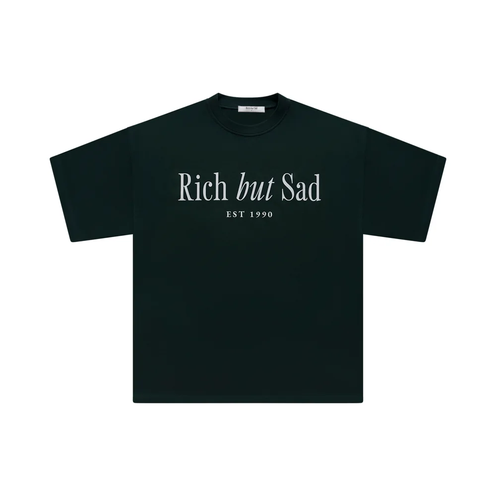 A product photo of the forest green Rich But Sad tee on white