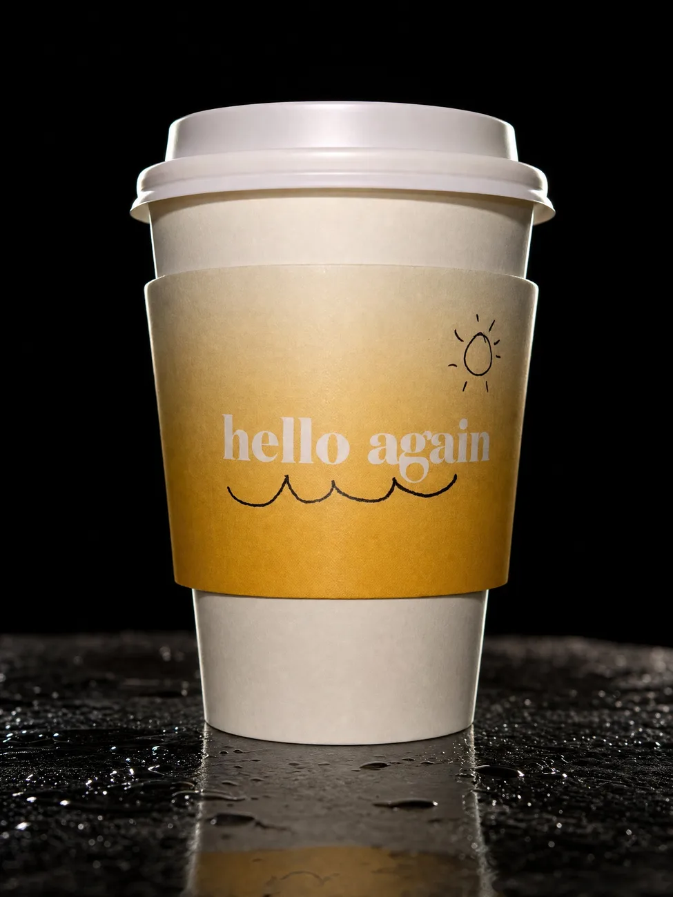 The Hello Again cup on wet black slate